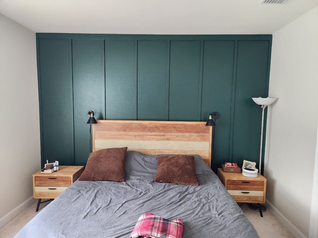 Green board and batten accent wall in a bedroom