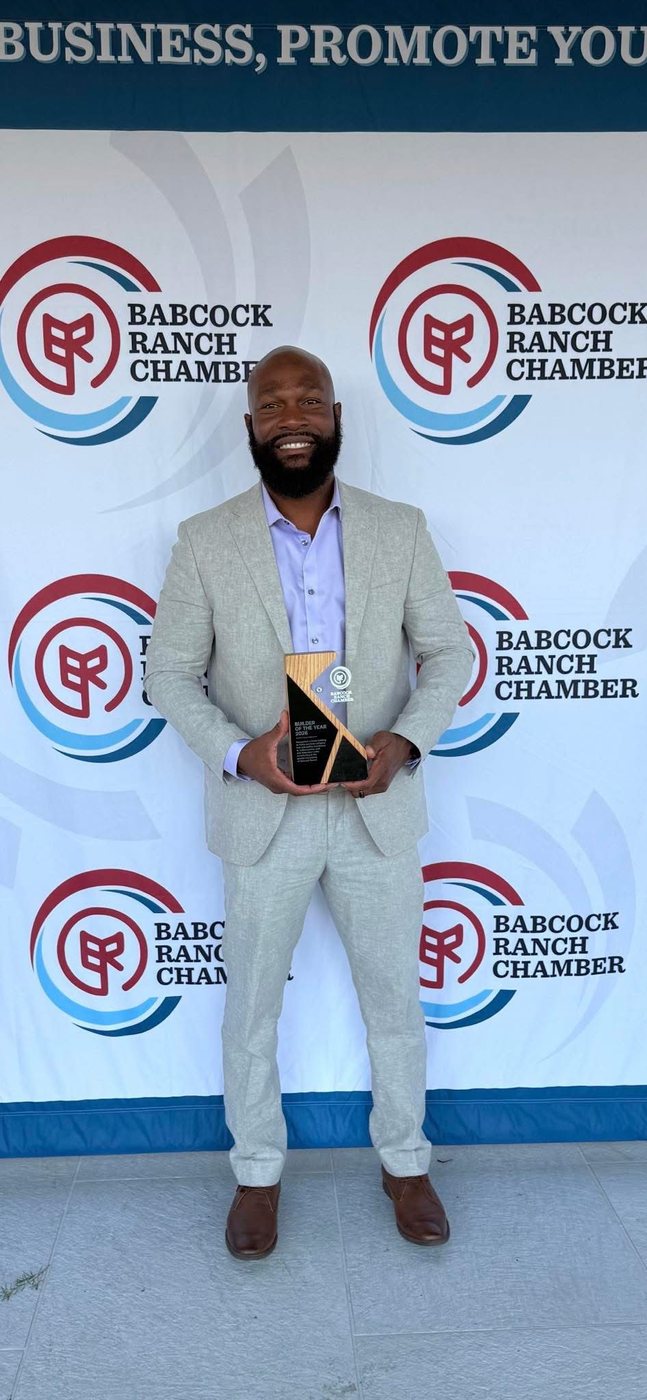 Garvin accepting the Babcock Ranch Chamber Builder of the Year 2026 award