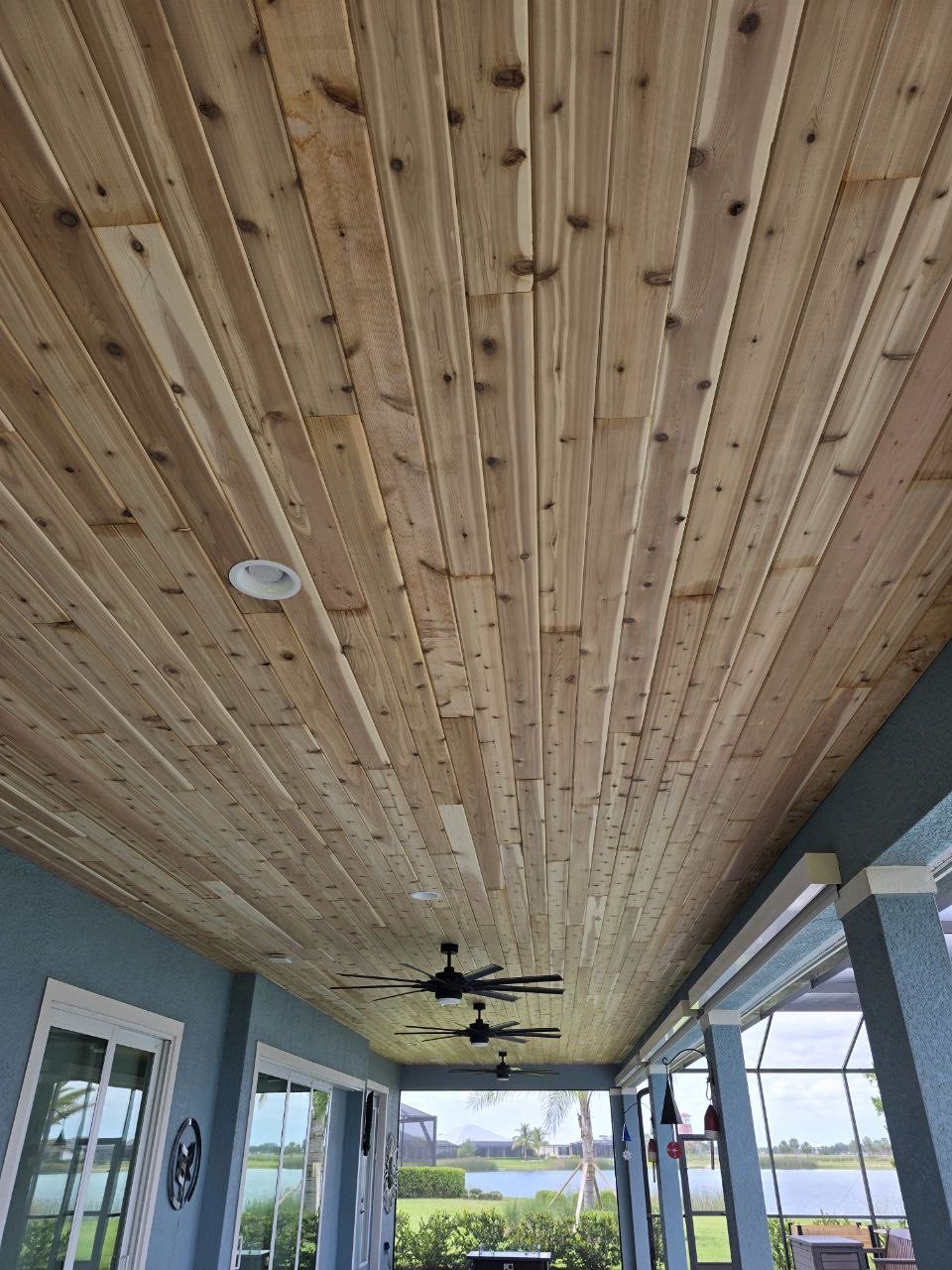 Tongue and groove wood ceiling on a screened lanai